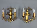 pair of antique brass wall sconces with frosted glass shades
