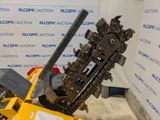 a machine that is sitting on the ground next to a wall