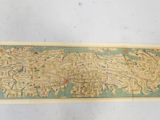 an old map of the world is shown on a white surface