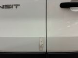 a close up of a white car with a logo on it
