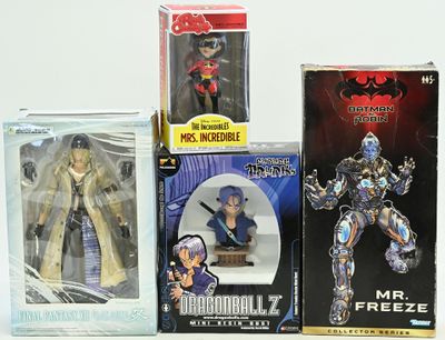 three boxes of action figures on a white surface