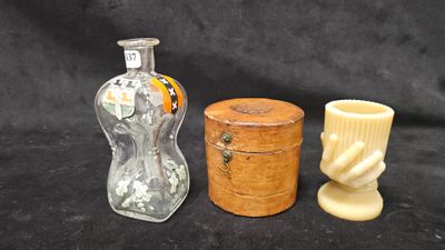 three small vases and a small vase on a black background