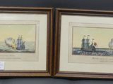 two framed prints of ships on display in a wooden frame