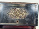 an old wooden box with a decorative design on it