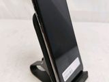 a cell phone that is sitting on top of a stand