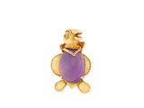 a close up of a purple and gold penguin broochle