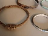 several different types of bracelets are displayed on a table
