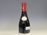 a bottle of wine that is sitting on a table