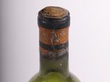 a bottle of wine that is sitting on a table