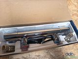 a box that has a spray gun inside of it