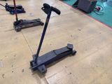 two jacks that are sitting on the floor in the garage