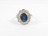 a blue sapphire and diamond cluster ring