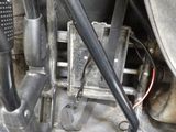 a close up view of a motorcycle engine with the seat down