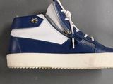 a close up of a pair of blue and white sneakers