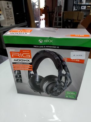 a close up of a box on a table with a pair of headphones