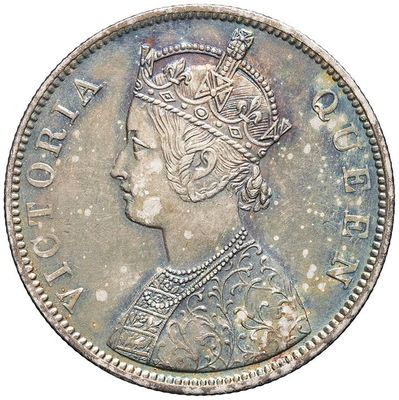 a close up of a coin with a crown on it