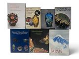 a lot of books that are sitting on a table