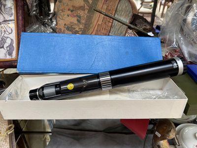 a pen that is sitting in a box on a table