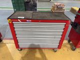 a red tool box sitting on top of a red cart