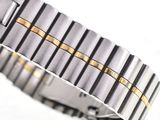 a close up of a watch on a white surface