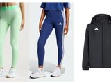 a woman in a blue top and green leggings and a black jacket