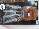a box with a pair of scissors in it on a table