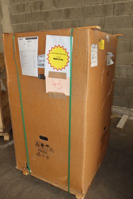 a large cardboard box sitting on top of a pallet in a warehouse