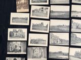 a lot of old photos on a black table