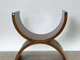 an image of a wooden bench with a curved seat