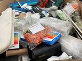a cardboard box filled with assorted items in a warehouse