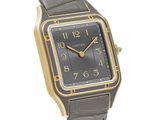 an image of a black and gold watch on a white background