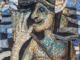 a mosaic of a man with a top hat and a cane
