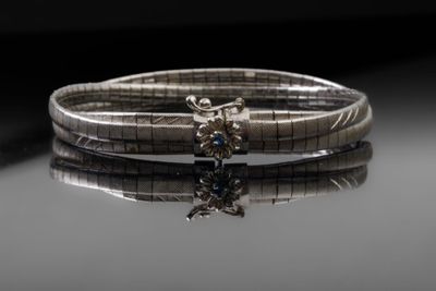 Bracelet en or gris composé de trois bracelets maille serpen…