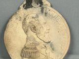 une image représentant une pièce de monnaie sur laquelle figure le portrait d'une femme