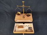 two wooden trays that have a scale on top of them