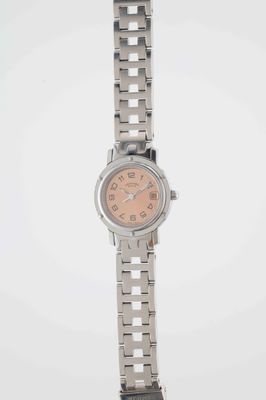 an image of a woman ' s wrist watch with a pink dial