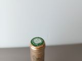 a bottle of wine that is sitting on a table