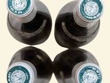 three bottles of coffee sitting on top of each other