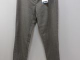 a pair of pants hanging on a hanger in a room