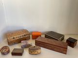 many different types of wooden boxes on the table
