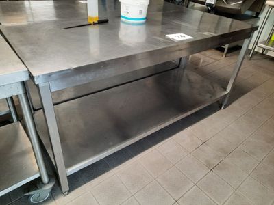 a stainless steel table with a bucket on top of it