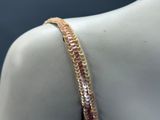 gold plated bracelet with pink and white beads on a mannequin mannequin mannequin mannequin mannequin mannequin mannequin