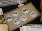 a box of buttons that are on a table