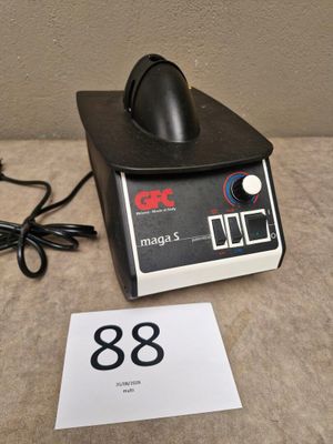 a black and white photo of a machine with a number on it