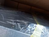 a box that is wrapped in plastic and sitting on the floor
