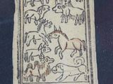 a picture of a plaque with animals on it
