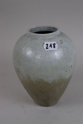 a gray vase with a number on it on a white background