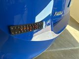 a sticker that says vauto on the front of a blue car
