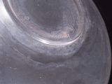 a close up of a glass vase with a hole in it