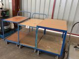 two tables and a cart in the garage